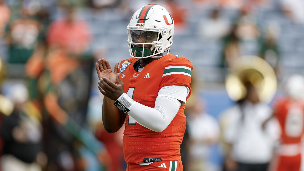 ORLANDO, FL - DECEMBER 28: Miami Hurricanes quarterback Cam Ward (1) looks on before the game between the Miami Hurricanes and the Iowa State Cyclones on December 28, 2024 at Camping World Stadium in Orlando, Fl.