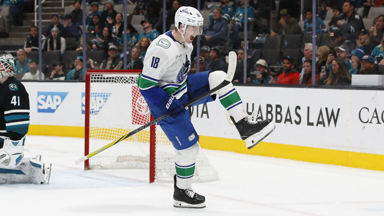 SAN JOSE, CA - FEBRUARY 06: Vancouver Canucks left wing Drew O'Connor (18) celebrates his game winning OT goal during the NHL game between the Vancouver Canucks and the San Jose Sharks on February 06, 2025 at SAP Center in San Jose, CA.