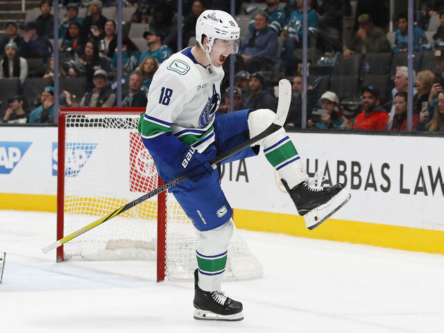 SAN JOSE, CA - FEBRUARY 06: Vancouver Canucks left wing Drew O'Connor (18) celebrates his game winning OT goal during the NHL game between the Vancouver Canucks and the San Jose Sharks on February 06, 2025 at SAP Center in San Jose, CA.