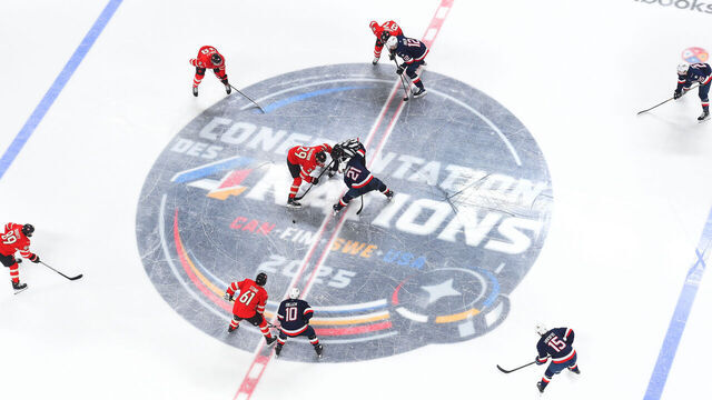 MONTREAL, QUEBEC - FEBRUARY 15: Nathan MacKinnon #29 of Team Canada and Dylan Larkin #21 of Team United States face off at center ice during the second period of the 4 Nations Face-Off game between the United States and Canada at Bell Centre on February 15, 2025 in Montreal, Quebec.