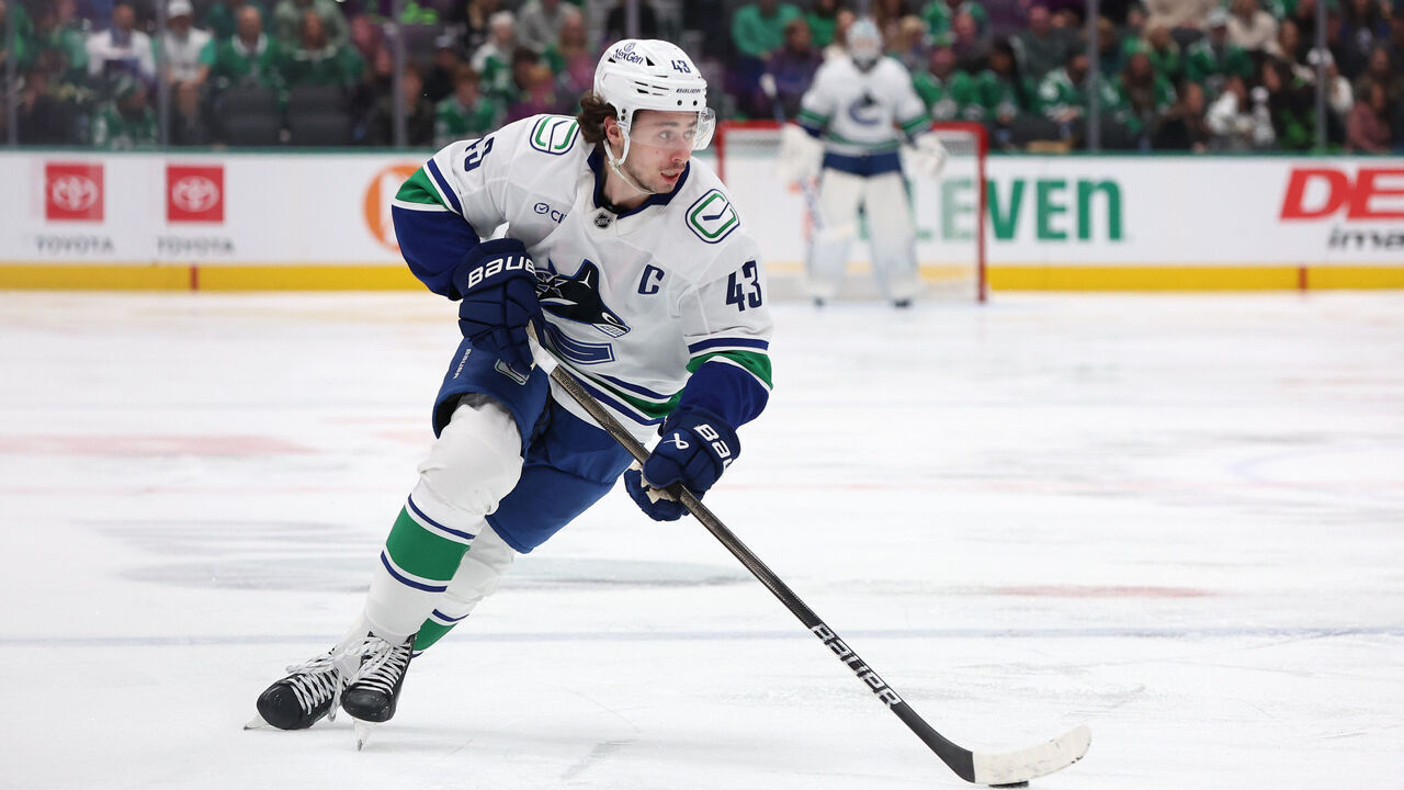 DALLAS, TEXAS - JANUARY 31: Quinn Hughes #43 of the Vancouver Canucks skates with the puck during the second period against the Dallas Stars at American Airlines Center on January 31, 2025 in Dallas, Texas.