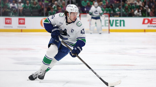 DALLAS, TEXAS - JANUARY 31: Quinn Hughes #43 of the Vancouver Canucks skates with the puck during the second period against the Dallas Stars at American Airlines Center on January 31, 2025 in Dallas, Texas.