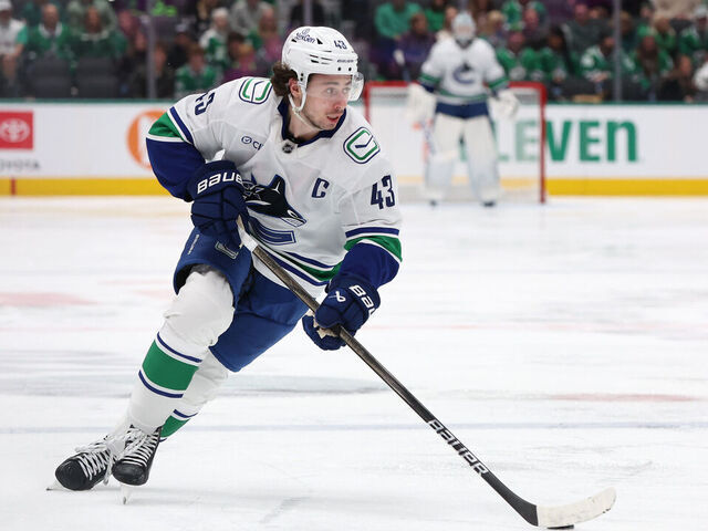 DALLAS, TEXAS - JANUARY 31: Quinn Hughes #43 of the Vancouver Canucks skates with the puck during the second period against the Dallas Stars at American Airlines Center on January 31, 2025 in Dallas, Texas.