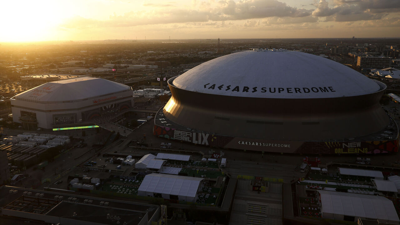 NEW ORLEANS, LOUISIANA - FEBRUARY 8: A general overall exterior view of sunset behind Caesars Superdome ahead of the NFL Super Bowl LIX football game between the Philadelphia Eagles and the Kansas City Chiefs on February 8, 2025 in New Orleans, Louisiana.