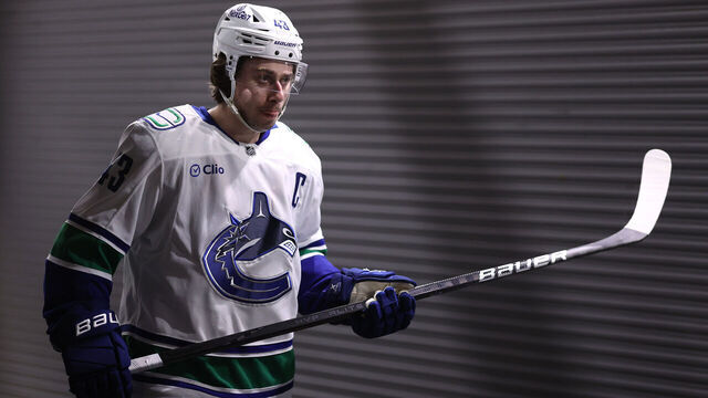 DALLAS, TEXAS - JANUARY 31: Quinn Hughes #43 of the Vancouver Canucks walks to the ice prior to the first period of the game against the Dallas Stars at American Airlines Center on January 31, 2025 in Dallas, Texas.