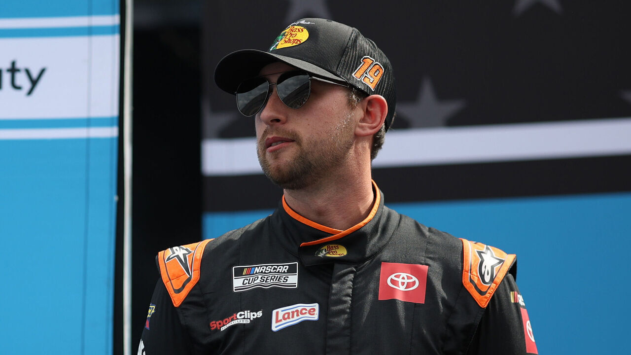 DAYTONA BEACH, FLORIDA - FEBRUARY 16: Chase Briscoe, driver of the #19 Bass Pro Shops Toyota stands onstage during driver intros prior to the NASCAR Cup Series Daytona 500 at Daytona International Speedway on February 16, 2025 in Daytona Beach, Florida.