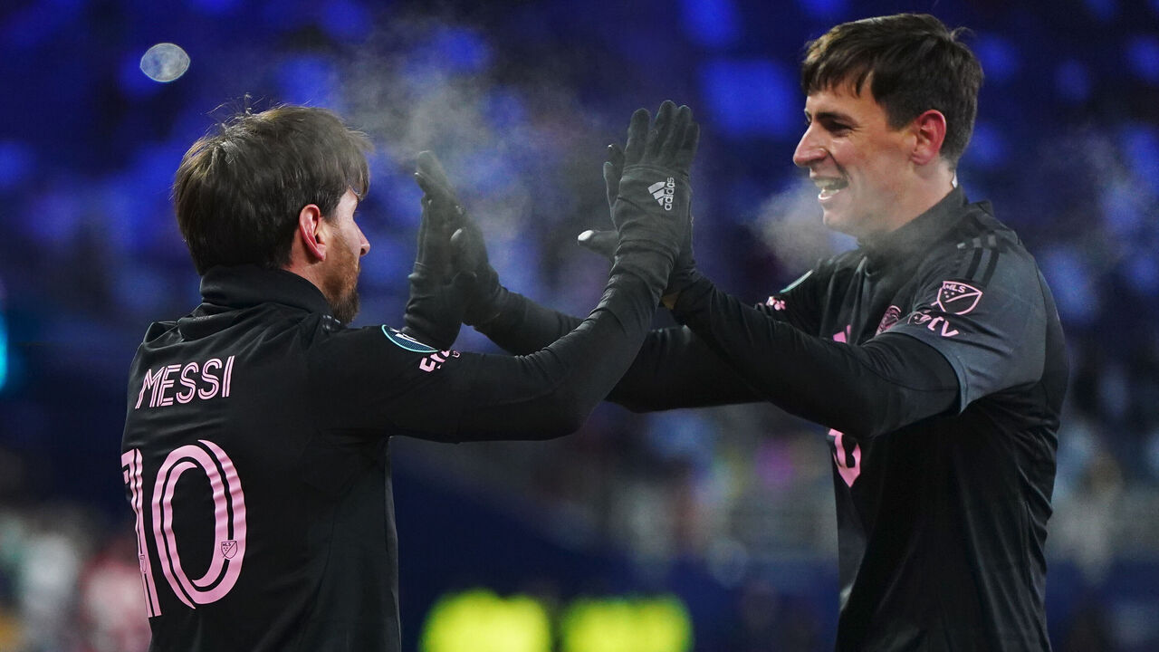 KANSAS CITY, KANSAS - FEBRUARY 19: Lionel Messi of Inter Miami celebrates with teammate Tadeo Allende after scoring the team's first goal during a 2025 Concacaf Champions Cup first leg match between Sporting Kansas City and Inter Miami at Sporting Park on February 19, 2025 in Kansas City, Kansas.