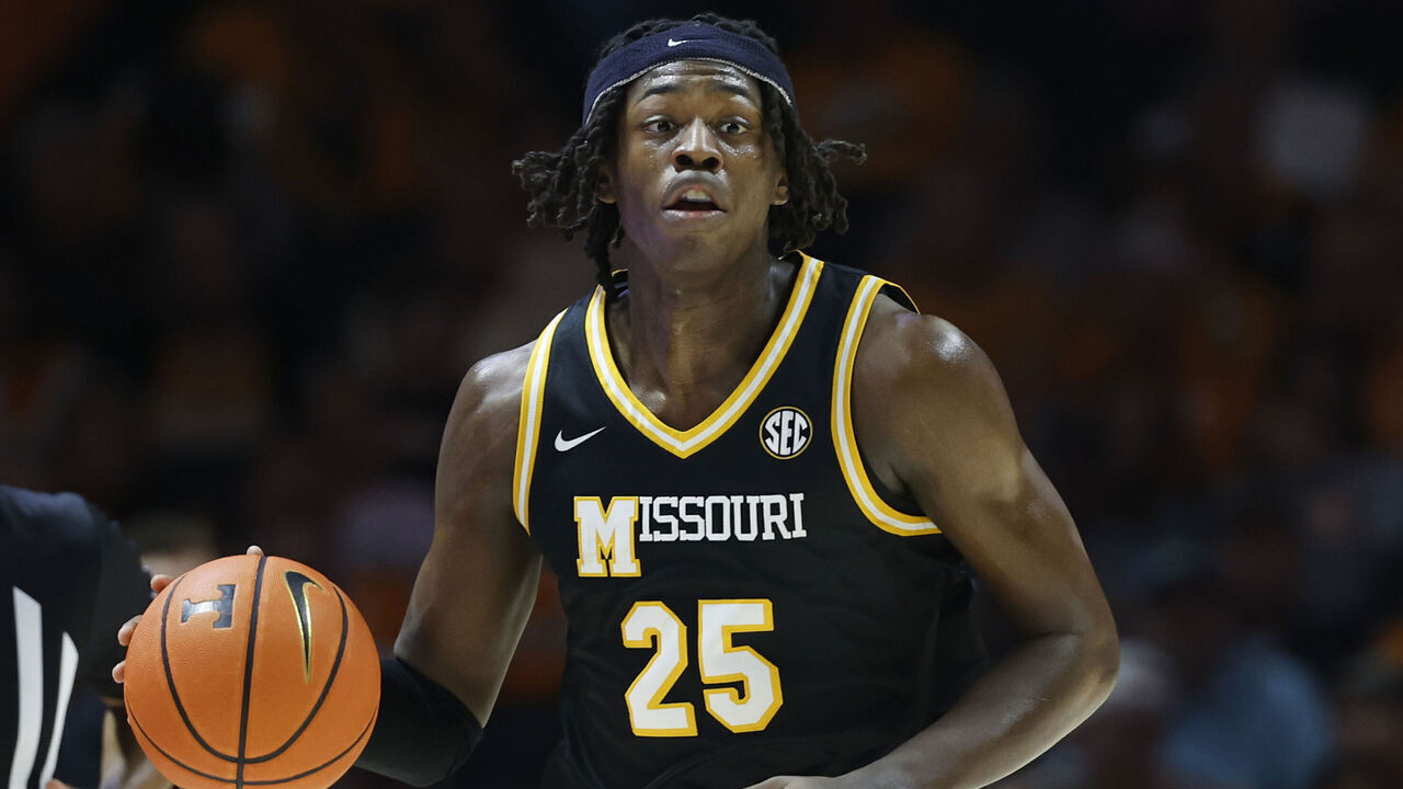 KNOXVILLE, TENNESSEE - FEBRUARY 05: Mark Mitchell #25 of the Missouri Tigers dribbles the ball during the first half against the Tennessee Volunteers at Thompson-Boling Arena on February 05, 2025 in Knoxville, Tennessee.