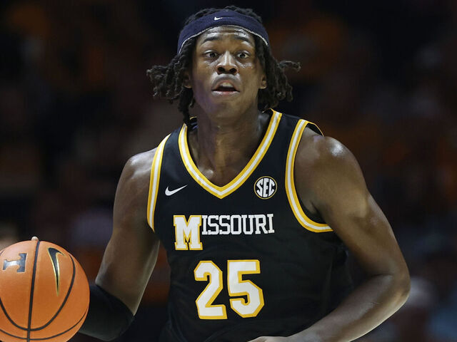 KNOXVILLE, TENNESSEE - FEBRUARY 05: Mark Mitchell #25 of the Missouri Tigers dribbles the ball during the first half against the Tennessee Volunteers at Thompson-Boling Arena on February 05, 2025 in Knoxville, Tennessee.