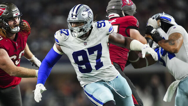 ARLINGTON, TX - DECEMBER 22: Osa Odighizuwa #97 of the Dallas Cowboys rushes the passer during an NFL football game against the Tampa Bay Buccaneers at AT&T Stadium on December 22, 2024 in Arlington, Texas.