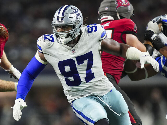 ARLINGTON, TX - DECEMBER 22: Osa Odighizuwa #97 of the Dallas Cowboys rushes the passer during an NFL football game against the Tampa Bay Buccaneers at AT&T Stadium on December 22, 2024 in Arlington, Texas.