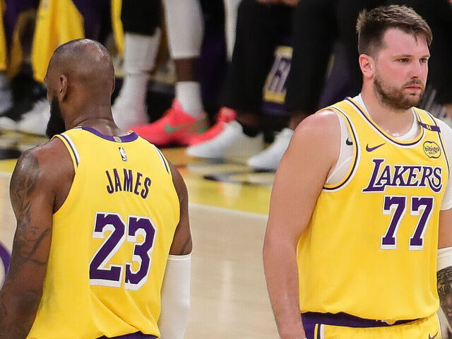 LOS ANGELES, CA - FEBRUARY 19: Los Angeles Lakers forward LeBron James (23) and Los Angeles Lakers guard Luka Doncic (77) during the NBA game between the Charlotte Hornets and the Los Angeles Lakers on February 19, 2025, at Crypto.com Arena in Los Angeles, CA.