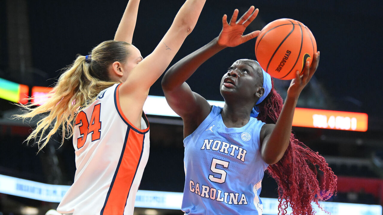 SYRACUSE, NEW YORK - FEBRUARY 20: Maria Gakdeng #5 of the North Carolina Tar Heels shoots against Izabel Varejao #34 of the Syracuse Orange during the first half at the JMA Wireless Dome on February 20, 2025 in Syracuse, New York.