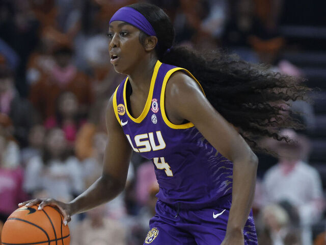 AUSTIN, TX - FEBRUARY 16: LSU Lady Tigers guard Flau'Jae Johnson (4) dribbles up the court against the Texas Longhorns during the game on February 16, 2025, at the Moody Center in Austin, TX.