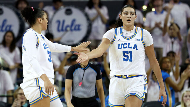 LOS ANGELES, CALIFORNIA - FEBRUARY 20: Lauren Betts #51 of the UCLA Bruins celebrates a basket with teammates Timea Gardiner #30 during the second quarter against the Illinois Fighting Illini at UCLA Pauley Pavilion on February 20, 2025 in Los Angeles, California.