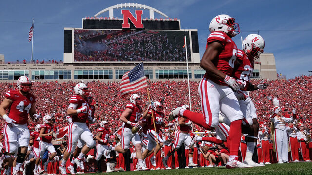LINCOLN, NE - SEPTEMBER 23: Fullback Harrison Jordan #38 of the Nebraska Cornhuskers carries the flag as the team enter the field against the Rutgers Scarlet Knights at Memorial Stadium on September 23, 2017 in Lincoln, Nebraska.