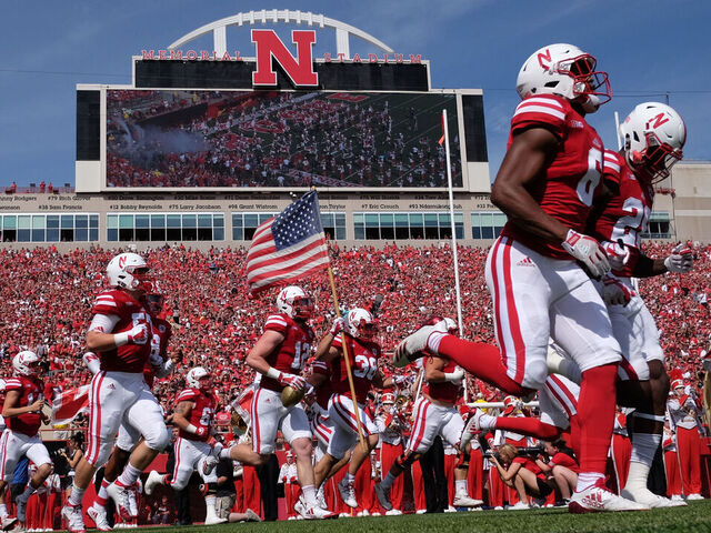 LINCOLN, NE - SEPTEMBER 23: Fullback Harrison Jordan #38 of the Nebraska Cornhuskers carries the flag as the team enter the field against the Rutgers Scarlet Knights at Memorial Stadium on September 23, 2017 in Lincoln, Nebraska.