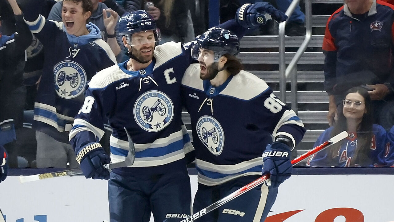 COLUMBUS, OHIO - OCTOBER 14: Boone Jenner #38 of the Columbus Blue Jackets is congratulated by Kirill Marchenko #86 after scoring a goal during the first period of the game against the New York Rangers at Nationwide Arena on October 14, 2023 in Columbus, Ohio.