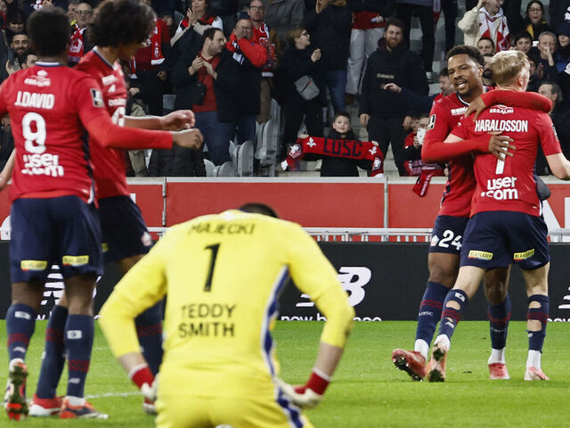 Lille's Icelandic midfielder #07 Hakon Haraldsson (R) celebrates with teammates after scoring during the French L1 football match between Lille LOSC and AS Monaco at the Stade Pierre-Mauroy in Villeneuve-d'Ascq, northern France, on February 22, 2025.