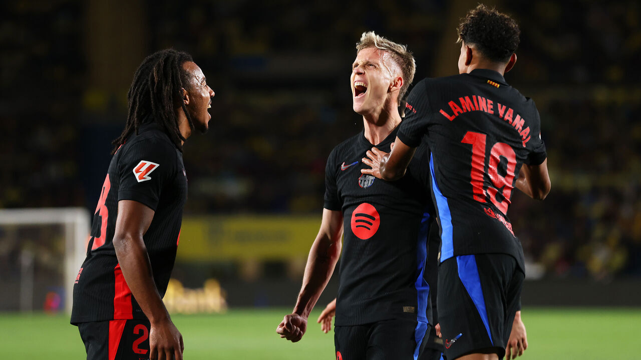 LAS PALMAS, SPAIN - FEBRUARY 22: Dani Olmo of FC Barcelona celebrates with his team mates Jules Kounde and Lamine Yamal after scoring his team's first goal during the LaLiga match between UD Las Palmas and FC Barcelona at Estadio Gran Canaria on February 22, 2025 in Las Palmas, Spain.