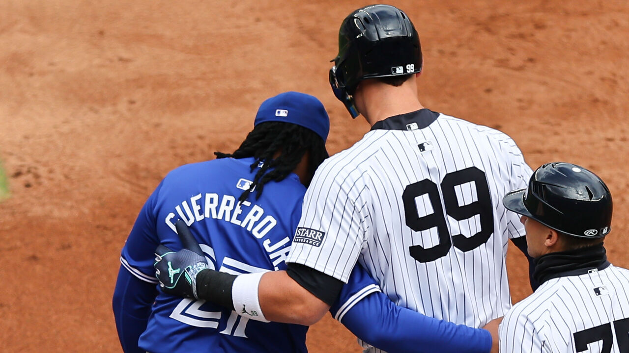 BRONX, NY - APRIL 05: Aaron Judge #99 of the New York Yankees and Vladimir Guerrero Jr. #27 of the Toronto Blue Jays hug during the game on April 5, 2024 at Yankee Stadium in the Bronx, New York.