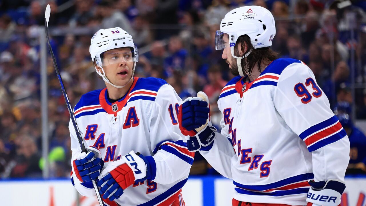 BUFFALO, NEW YORK - FEBRUARY 22: Artemi Panarin #10 and Mika Zibanejad #93 of the New York Rangers discuss an upcoming face off during an NHL against the Buffalo Sabres game on February 22, 2025 at KeyBank Center in Buffalo, New York.