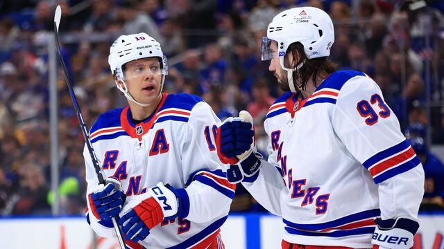 BUFFALO, NEW YORK - FEBRUARY 22: Artemi Panarin #10 and Mika Zibanejad #93 of the New York Rangers discuss an upcoming face off during an NHL against the Buffalo Sabres game on February 22, 2025 at KeyBank Center in Buffalo, New York.