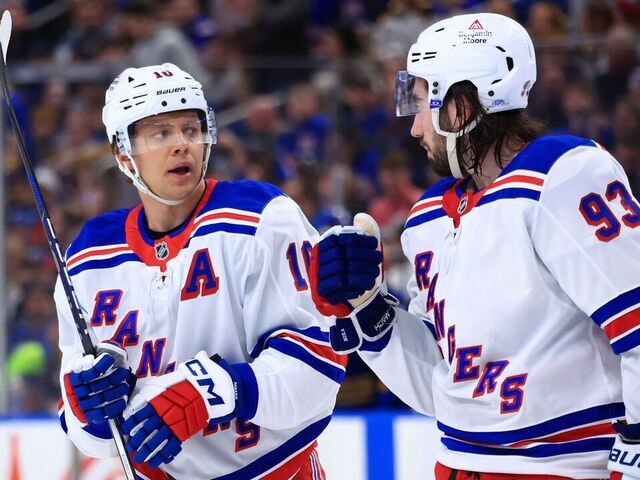 BUFFALO, NEW YORK - FEBRUARY 22: Artemi Panarin #10 and Mika Zibanejad #93 of the New York Rangers discuss an upcoming face off during an NHL against the Buffalo Sabres game on February 22, 2025 at KeyBank Center in Buffalo, New York.