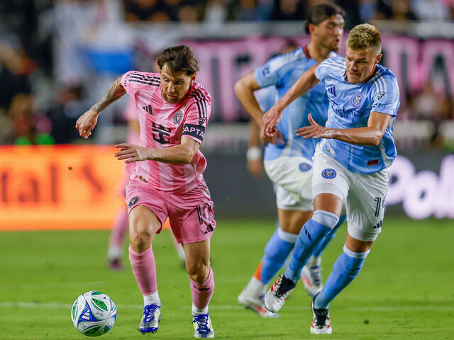 FORT LAUDERDALE, FLORIDA - FEBRUARY 22: Lionel Messi #10 of Inter Miami CF and Keaton Parks #55 of New York City FC battle for the ball during the first half of the game between Inter Miami CF and New York City FC at Chase Stadium on February 22, 2025 in Fort Lauderdale, Florida.