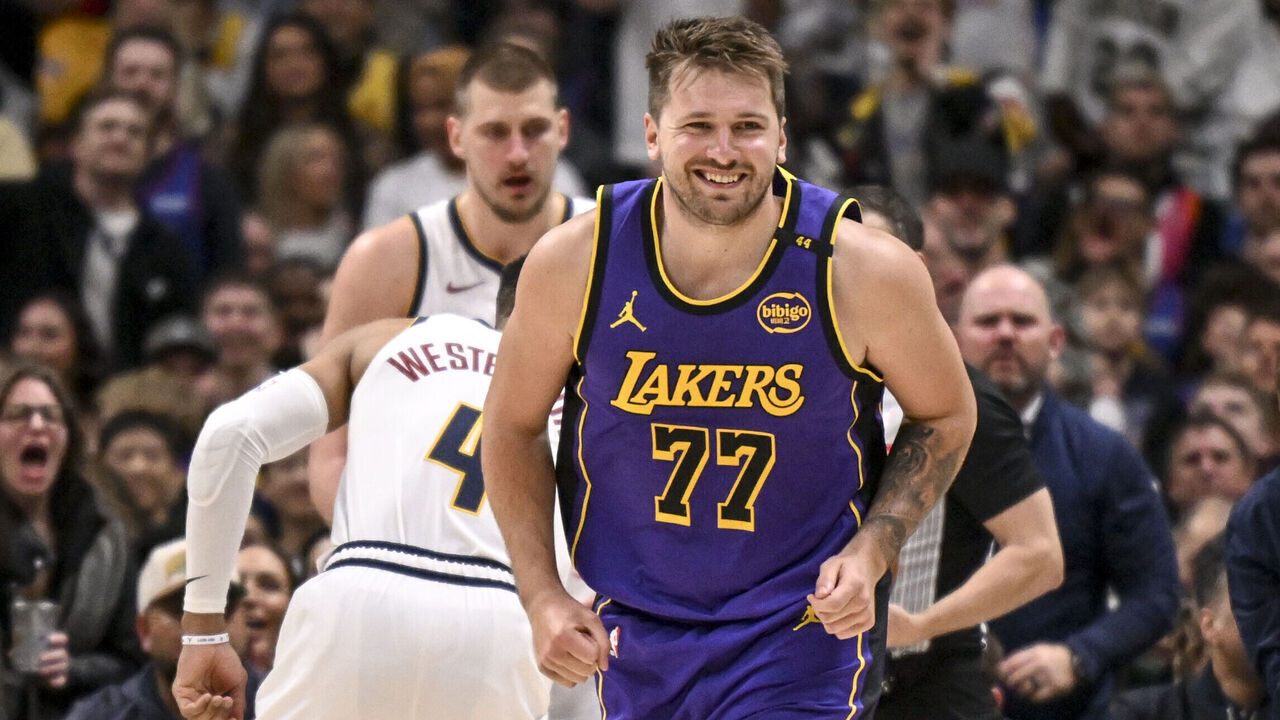 DENVER, CO - FEBRUARY 22: Luka Doncic (77) of the Los Angeles Lakers sneers after losing possession of the ball after a swift poke by Christian Braun (0) of the Denver Nuggets as Braun his helped to his feet by Russell Westbrook (4) and Nikola Jokic (15) during the second quater at Ball Arena in Denver, Colorado on Saturday, February 22, 2025.