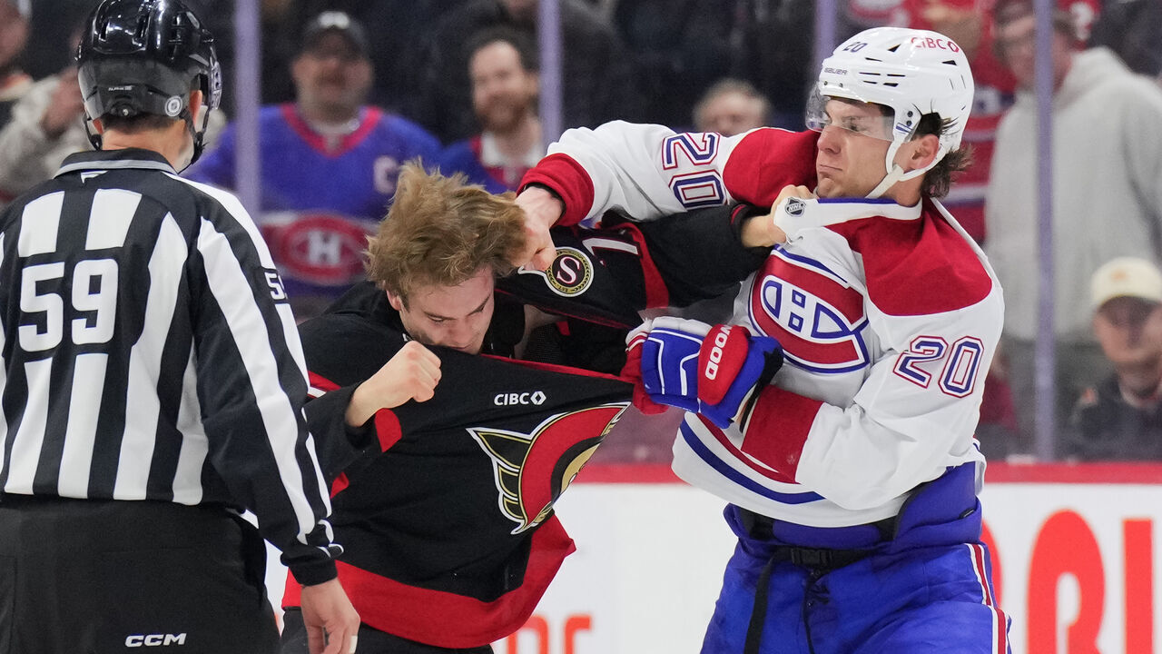 OTTAWA, CANADA - FEBRUARY 22: Juraj Slafkovsky #20 of the Montreal Canadiens fights Ridly Greig #71 of the Ottawa Senators during the third period at Canadian Tire Centre on February 22, 2025 in Ottawa, Ontario, Canada.