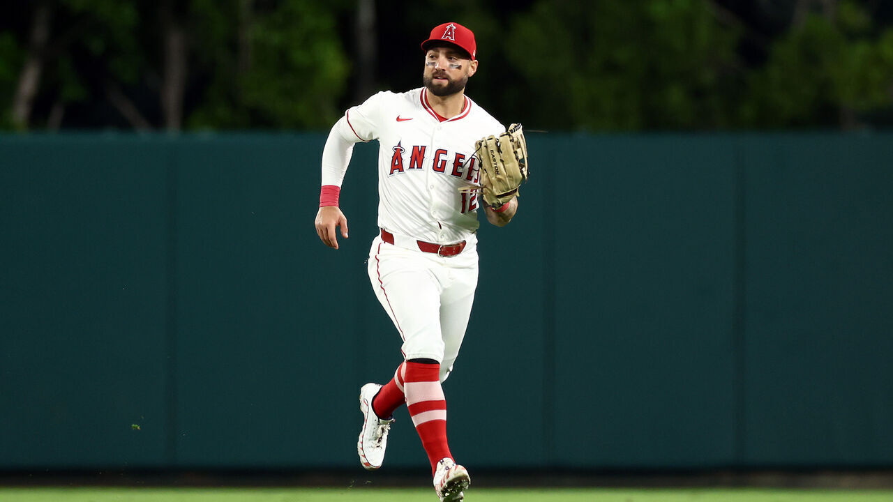 ANAHEIM, CALIFORNIA - SEPTEMBER 28: Kevin Pillar #12 of the Los Angeles Angels makes a catch in the outfield during the ninth inning against the Texas Rangers at Angel Stadium of Anaheim on September 28, 2024 in Anaheim, California.