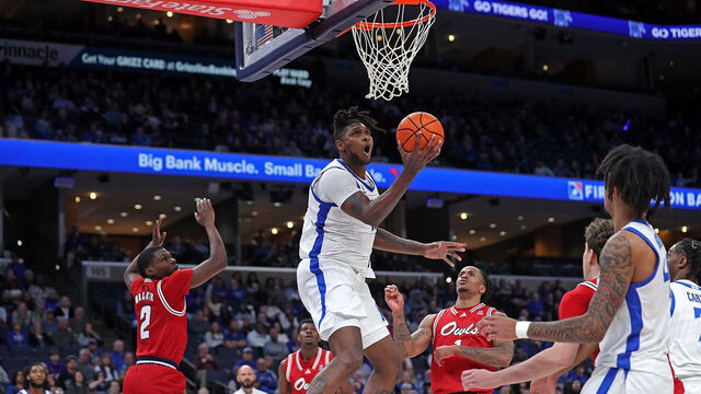 MEMPHIS, TENNESSEE - FEBRUARY 23: Dain Dainja #42 of the Memphis Tigers goes to the basket during the first half against the Florida Atlantic Owls at FedExForum on February 23, 2025 in Memphis, Tennessee.