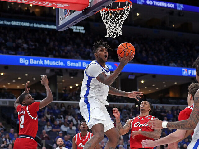MEMPHIS, TENNESSEE - FEBRUARY 23: Dain Dainja #42 of the Memphis Tigers goes to the basket during the first half against the Florida Atlantic Owls at FedExForum on February 23, 2025 in Memphis, Tennessee.