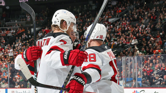 PHILADELPHIA, PENNSYLVANIA - JANUARY 27: Dougie Hamilton #7 of the New Jersey Devils celebrates his second period goal against the Philadelphia Flyers with teammtes Ondrej Palat #18 and Jesper Bratt #63 at the Wells Fargo Center on January 27, 2025 in Philadelphia, Pennsylvania.