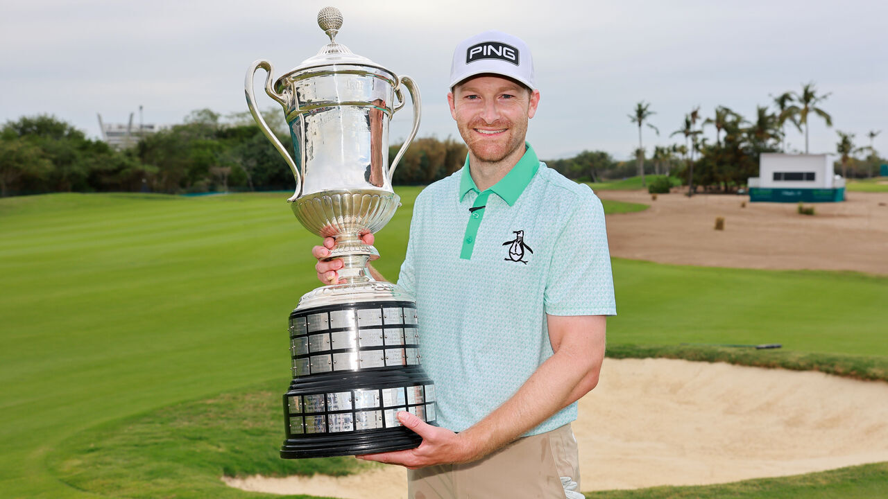 PUERTO VALLARTA, MEXICO - FEBRUARY 23: Brian Campbell of the United States poses with the trophy on the 18th hole after putting in to win during the second playoff hole of the final round of the Mexico Open at VidantaWorld 2025 at Vidanta Vallarta on February 23, 2025 in Puerto Vallarta, Mexico.