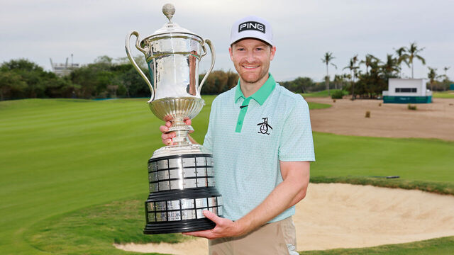PUERTO VALLARTA, MEXICO - FEBRUARY 23: Brian Campbell of the United States poses with the trophy on the 18th hole after putting in to win during the second playoff hole of the final round of the Mexico Open at VidantaWorld 2025 at Vidanta Vallarta on February 23, 2025 in Puerto Vallarta, Mexico.