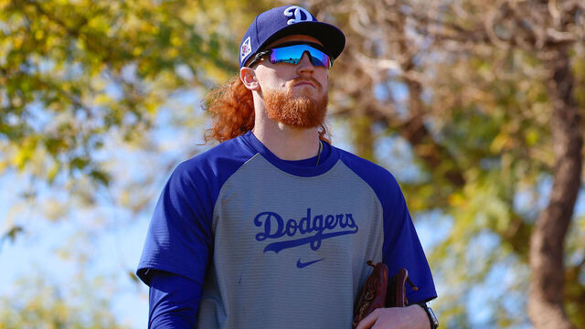 GLENDALE, ARIZONA - FEBRUARY 15: Dustin May #85 of the Los Angeles Dodgers walks between fields during spring training workouts at Camelback Ranch on February 15, 2025 in Glendale, Arizona.