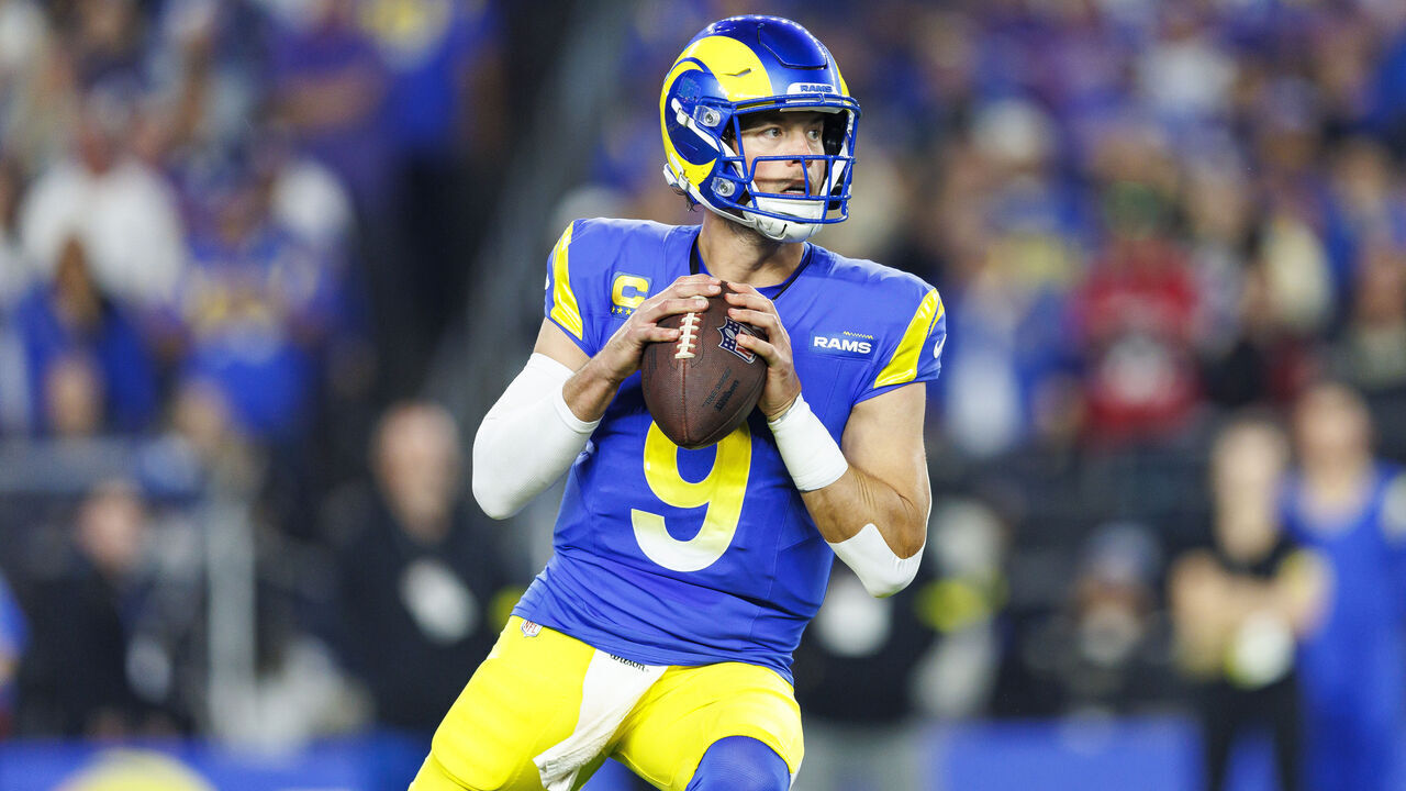 GLENDALE, ARIZONA - JANUARY 13: Quarterback Matthew Stafford #9 of the Los Angeles Rams drops back to pass during the first half of an NFC Wild Card game against the Minnesota Vikings, at State Farm Stadium on January 13, 2025 in Glendale, Arizona.