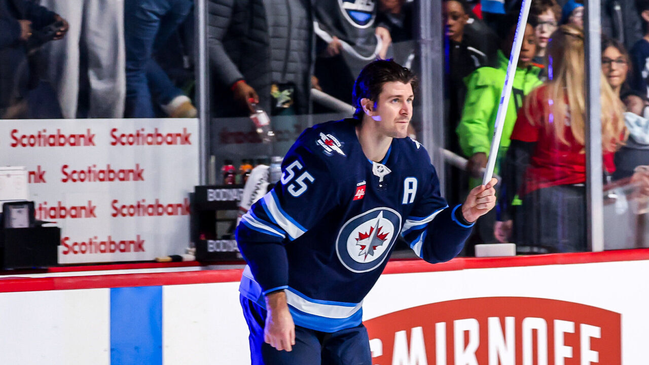 WINNIPEG, CANADA - JANUARY 11: Mark Scheifele #55 of the Winnipeg Jets salutes the fans after receiving third star honours following a 3-0 shutout victory over the Colorado Avalanche at the Canada Life Centre on January 11, 2025 in Winnipeg, Manitoba, Canada.