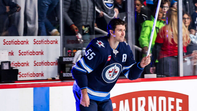 WINNIPEG, CANADA - JANUARY 11: Mark Scheifele #55 of the Winnipeg Jets salutes the fans after receiving third star honours following a 3-0 shutout victory over the Colorado Avalanche at the Canada Life Centre on January 11, 2025 in Winnipeg, Manitoba, Canada.