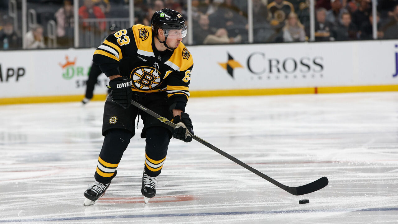 BOSTON, MASSACHUSETTS - FEBRUARY 4: Brad Marchand #63 of the Boston Bruins skates the puck against the Minnesota Wild during the third period at the TD Garden on February 4, 2025 in Boston, Massachusetts. The Bruins won 3-0.