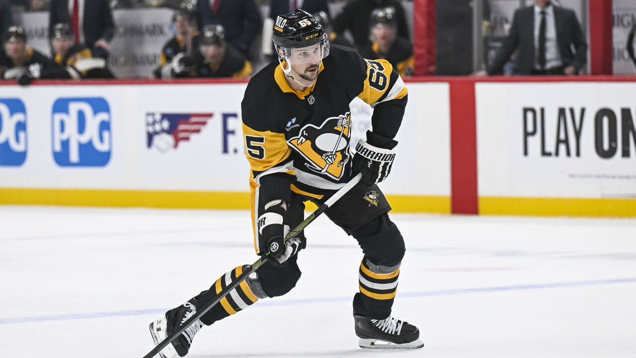 PITTSBURGH, PA - FEBRUARY 22: Pittsburgh Penguins defenseman Erik Karlsson (65) shoots the puck during the first period in the NHL game between the Pittsburgh Penguins and the Washington Capitals on February 22, 2025, at PPG Paints Arena in Pittsburgh, PA.