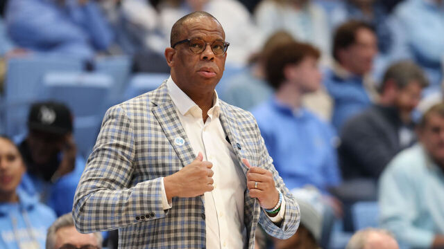CHAPEL HILL, NC - JANUARY 15: North Carolina Tar Heels head coach Hubert Davis adjusts his jacket during the college basketball game between the North Carolina Tar Heels and the California Golden Bears on January 15, 2025 at the Dean Smith Center in Chapel Hill, NC.