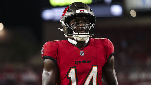 TAMPA, FLORIDA - OCTOBER 21: Chris Godwin #14 of the Tampa Bay Buccaneers warms up prior to an NFL football game against the Baltimore Ravens at Raymond James Stadium on October 21, 2024 in Tampa, Florida.