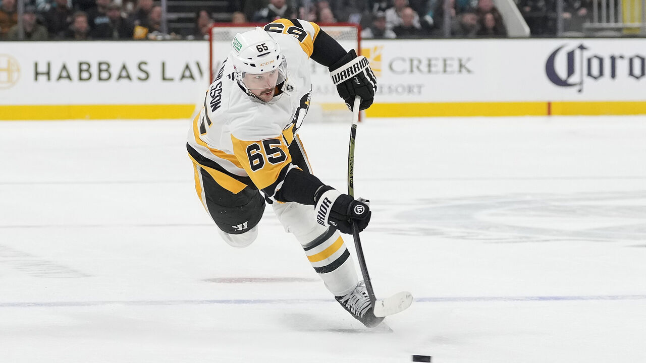 SAN JOSE, CALIFORNIA - JANUARY 27: Erik Karlsson #65 of the Pittsburgh Penguins shoots on goal against the San Jose Sharks during the third period of an NHL hockey game at SAP Center on January 27, 2025 in San Jose, California.