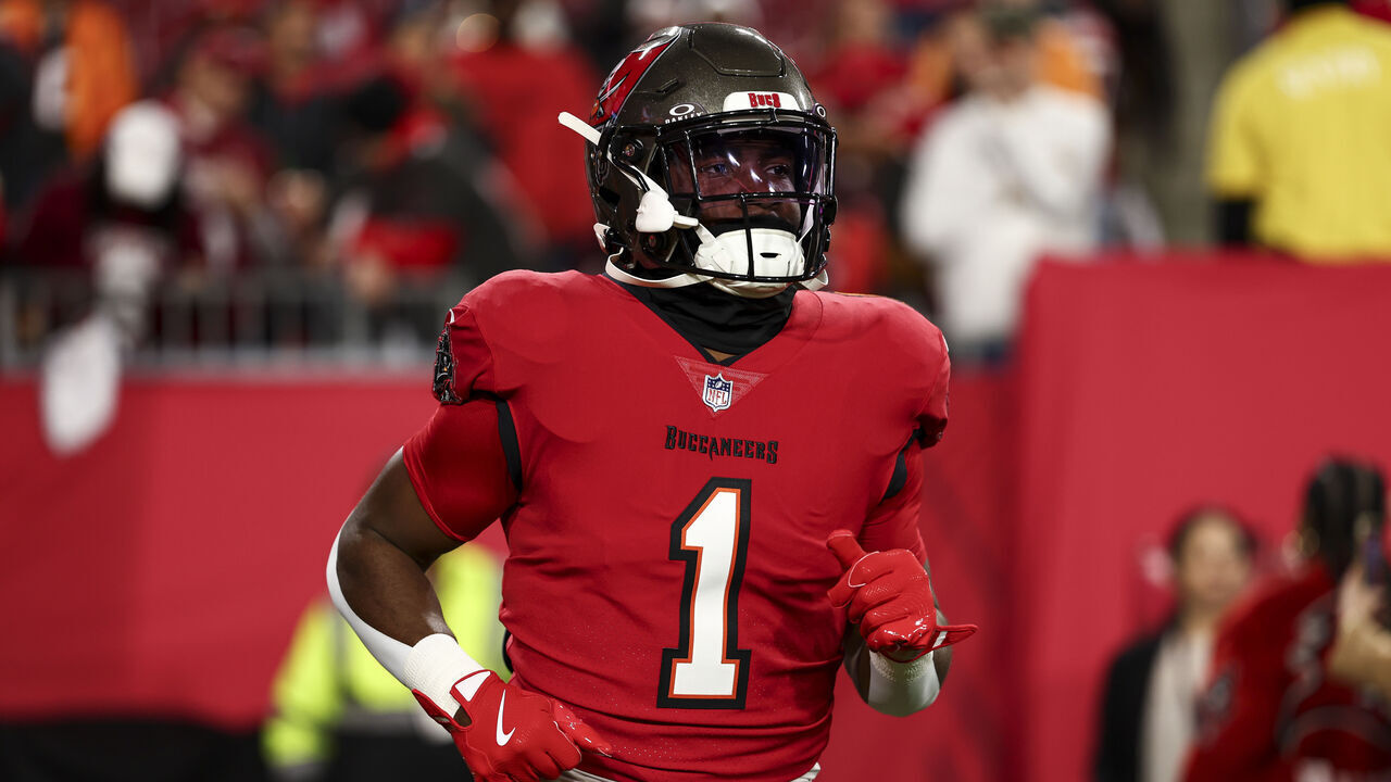 TAMPA, FLORIDA - JANUARY 12: Rachaad White #1 of the Tampa Bay Buccaneers warms up prior to an NFL football wild card playoff game against the Washington Commanders at Raymond James Stadium on January 12, 2025 in Tampa, Florida.