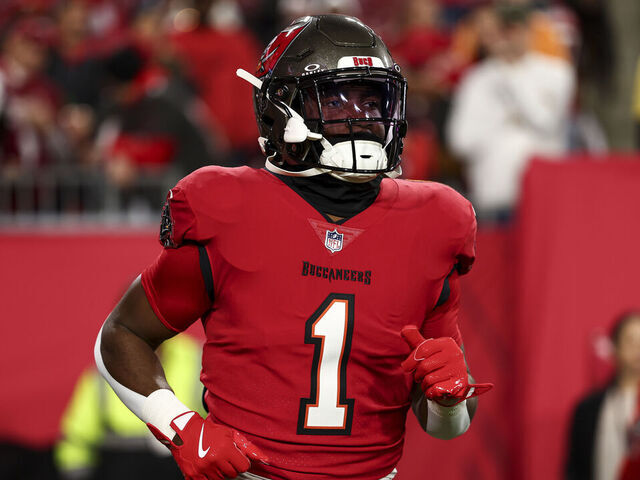 TAMPA, FLORIDA - JANUARY 12: Rachaad White #1 of the Tampa Bay Buccaneers warms up prior to an NFL football wild card playoff game against the Washington Commanders at Raymond James Stadium on January 12, 2025 in Tampa, Florida.