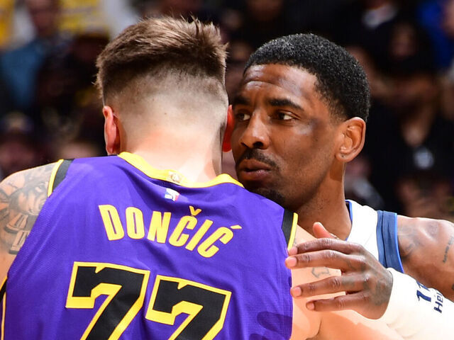 LOS ANGELES, CA - FEBRUARY 25: Kyrie Irving #11 of the Dallas Mavericks and Luka Doncic #77 of the Los Angeles Lakers hug before the game on February 25, 2025 at Crypto.Com Arena in Los Angeles, California. NOTE TO USER: User expressly acknowledges and agrees that, by downloading and/or using this Photograph, user is consenting to the terms and conditions of the Getty Images License Agreement. Mandatory Copyright Notice: Copyright 2025 NBAE