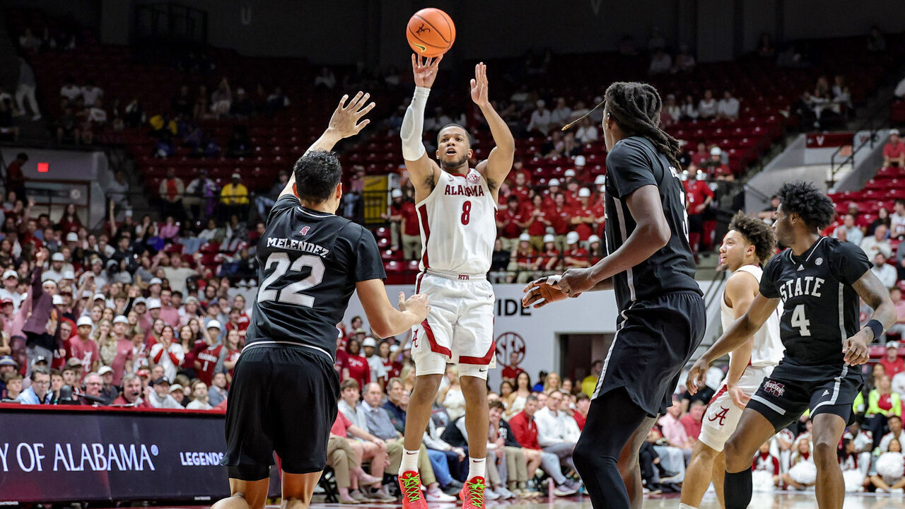 TUSCALOOSA, ALABAMA - FEBRUARY 25: Chris Youngblood #8 of the Alabama Crimson Tide shoots from the three-point line over RJ Melendez #22 of the Mississippi State Bulldogs in the second half at Coleman Coliseum on February 25, 2025 in Tuscaloosa, Alabama.